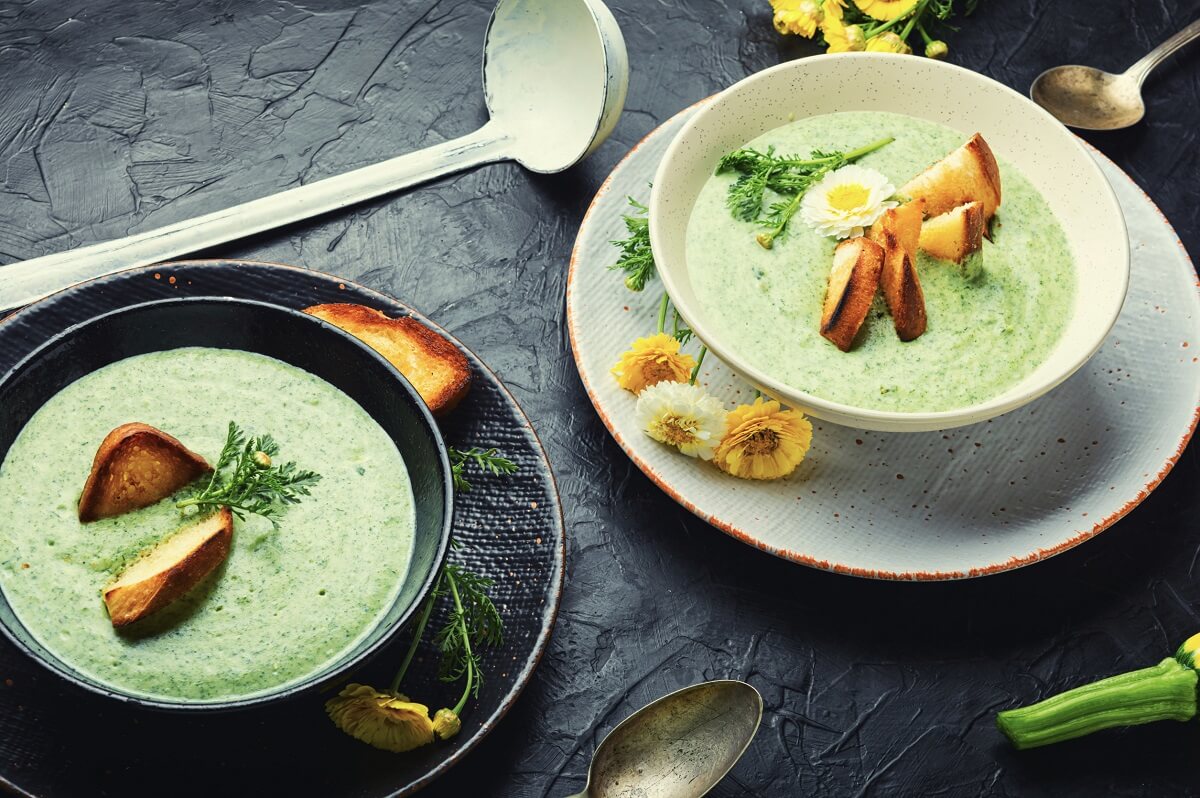 Tasty and healthy creamy nettle soup with spicy croutons